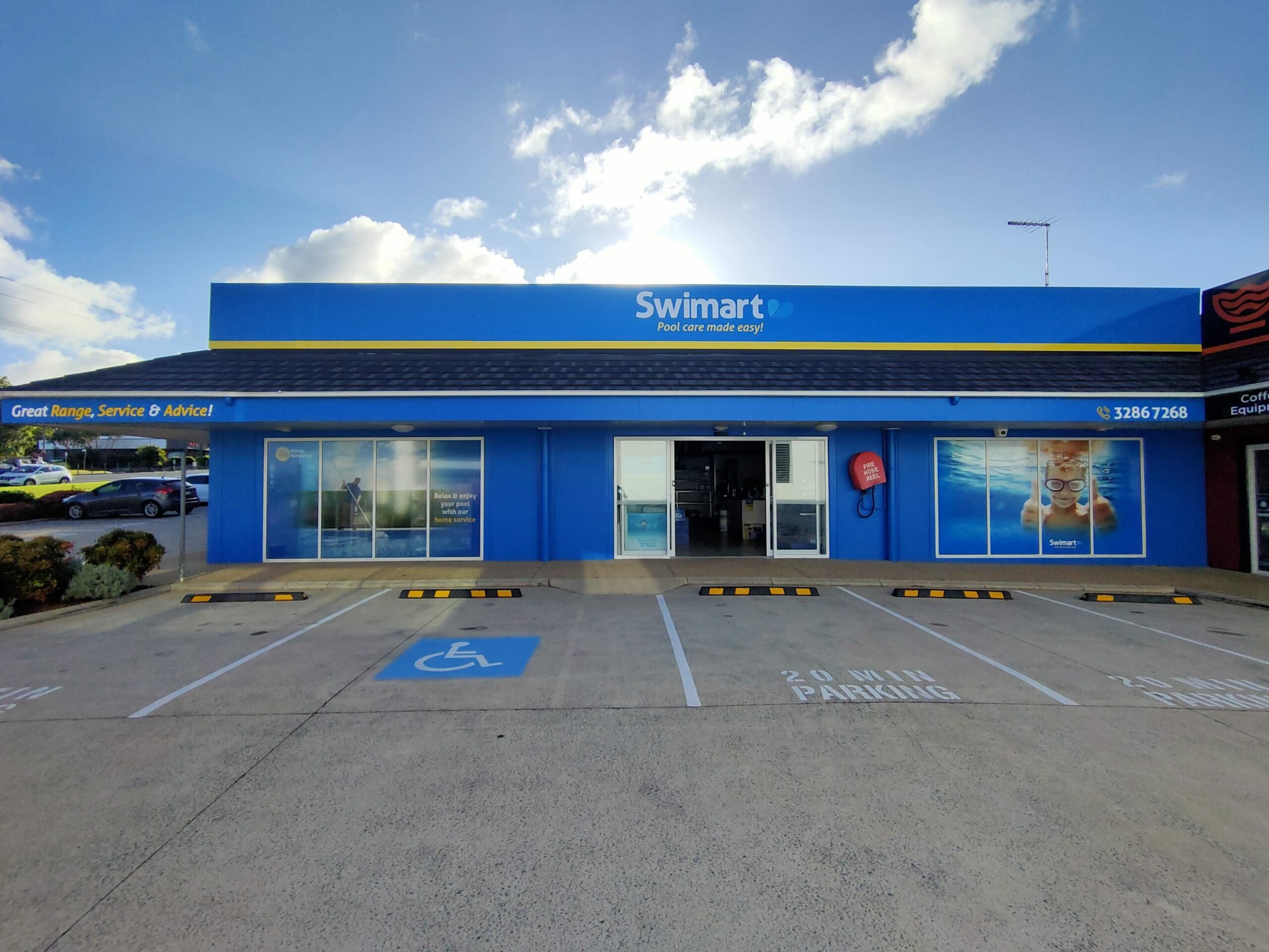 Swimart Cleveland Store frontage with 20min parking spots and disabled carspot.
